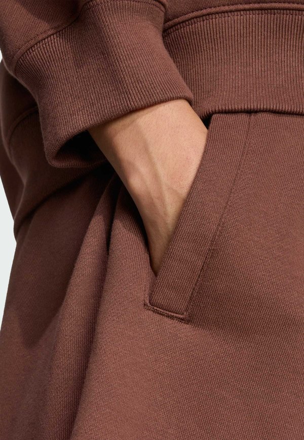 ESSENTIALS LINEAR  - Tracksuit bottoms - auburn2