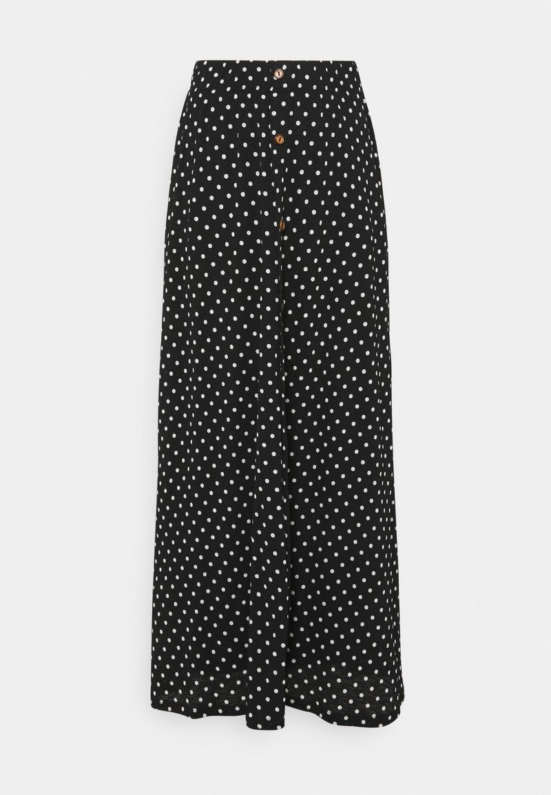 Falda negra con lunares que presenta una cintura alta, cierre de botones en la parte delantera y una tela ligera y fluida con un diseño de pierna ancha.