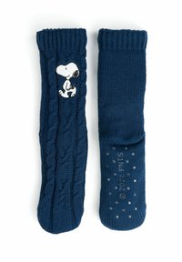 Calzini antiscivolo in maglia blu navy con motivo a treccia, caratterizzati da un design di Snoopy bianco e suole puntinate per una migliore aderenza.