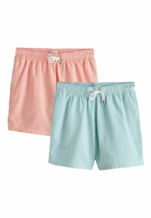 Dva páry pruhovaných plavkových šortiek v ružovej a svetlomodrej farbe, každý s elastickým pásom a bielym šnúrkovým zaväzovaním.