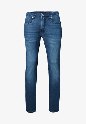 Levi's clásicos jeans de mezclilla azul de corte recto, con cinco bolsillos, cierre de cremallera y costuras a contraste. Textura suave, lavado medio.