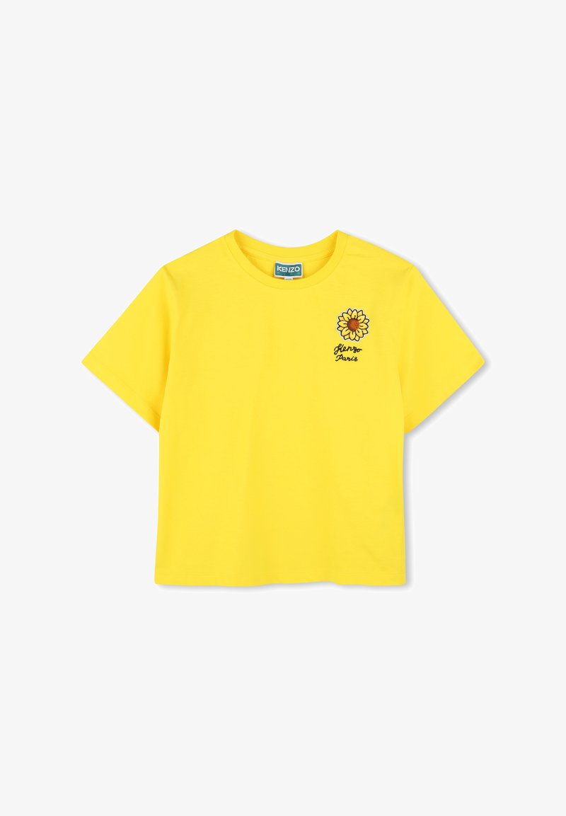 T-shirt en coton jaune à manches courtes, avec un graphique de tournesol et le texte "Kenzo Paris" en broderie noire sur la poitrine.