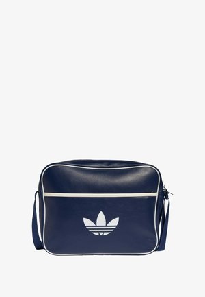 Blue synthetic shoulder bag with white accents, featuring a front logo and a zip closure. Rectangular shape with a textured surface.