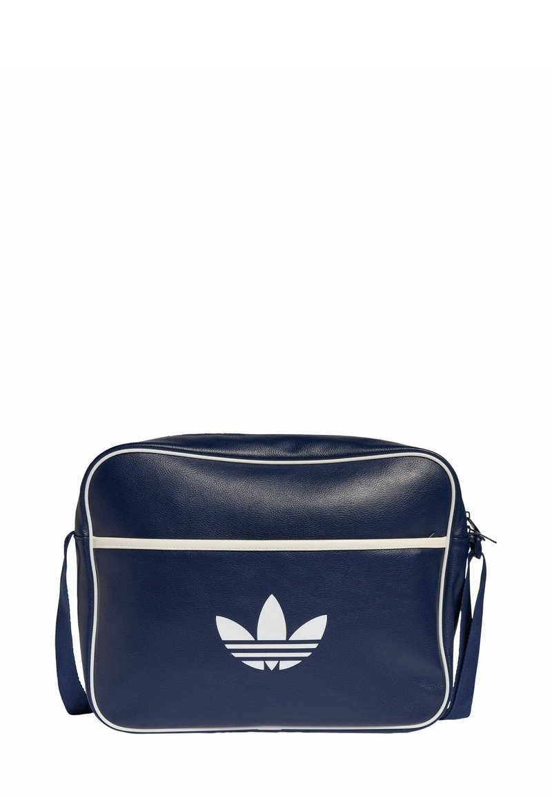 Niebieska syntetyczna torebka na ramię z białymi akcentami, ozdobiona przednim logo i zamkiem błyskawicznym. Prostokątny kształt z fakturowaną powierzchnią.