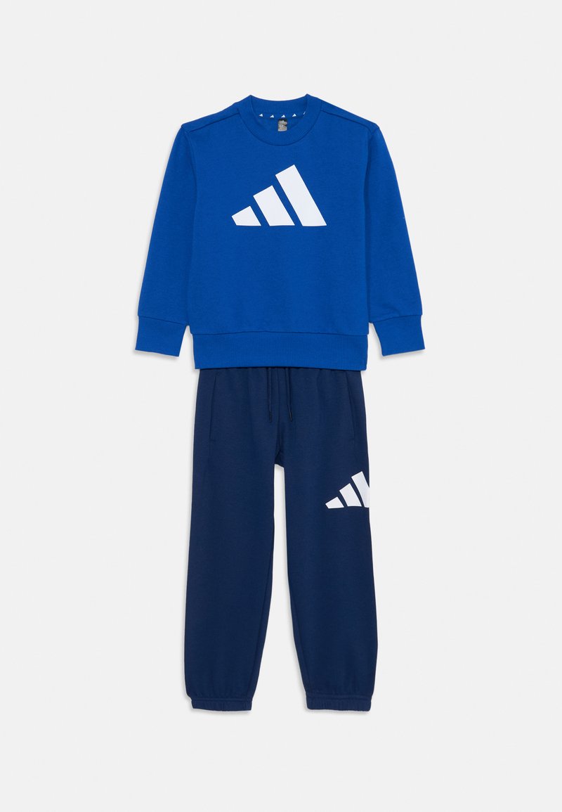 Blue sweatshirt with a white Adidas logo, paired with navy sweatpants featuring a white logo. Soft fabric, relaxed fit, elastic cuffs.
