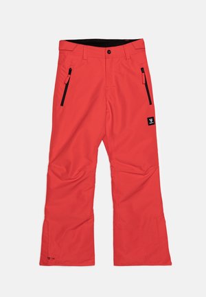 Pantalon de ski rouge en tissu résistant et déperlant, avec deux poches zippées et une ceinture noire. Coupe droite.