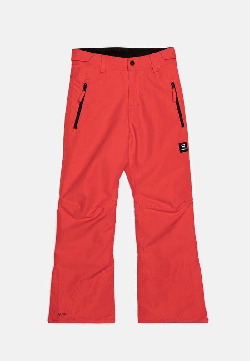 Pantalon de ski rouge en tissu résistant et déperlant, avec deux poches zippées et une ceinture noire. Coupe droite.