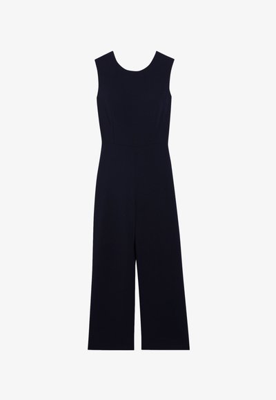 Combinaison bleu marine sans manches, avec un col rond et des jambes larges et courtes, fabriquée à partir d'un tissu lisse sans motifs ni accents.