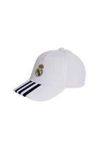 White baseball cap with navy stripes on the brim, featuring an embroidered Real Madrid logo on the front. Made of durable fabric.