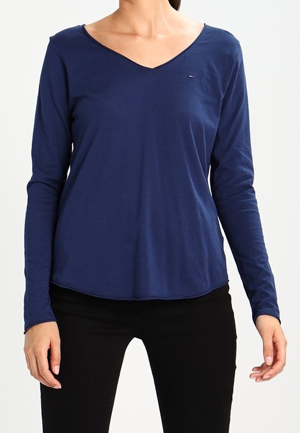 Laivan sininen pitkähihaista paitaa, jossa on V-pääntie, valmistettu pehmeästä kankaasta, ja jossa on pieni logo rintakehässä sekä kaareva helma.