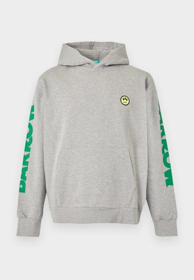Light grey hooded sweatshirt with front pocket, small yellow smiley face on chest, and large green text on both sleeves.