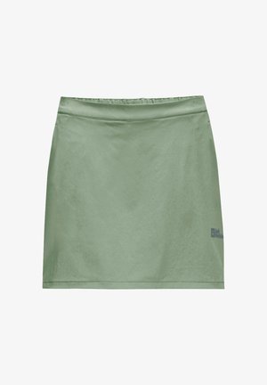 Short green skirt with a smooth, shiny texture, featuring an elastic waistband and a small logo on the lower right side.