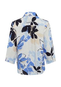 Floral shirt with three-quarter sleeves, featuring a light fabric in shades of blue, black, and beige. Oversized floral print throughout.