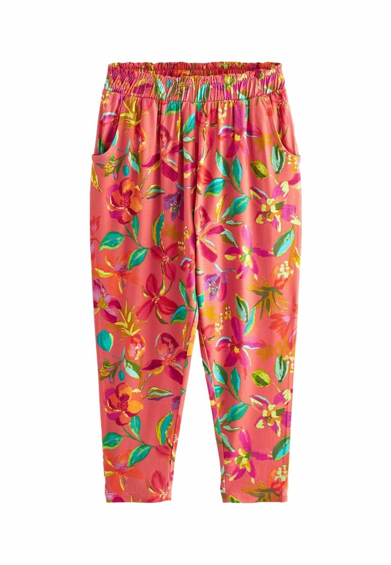 Pantalon corail vif avec une taille élastique, de grandes poches latérales et un imprimé floral coloré en rose, vert, jaune et bleu.