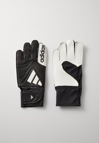 Gants de gardien Adidas, avec un design rembourré noir et une paume blanche, grip texturé, et une sangle de poignet réglable avec logo.