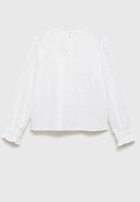 Blusa bianca con scollatura rotonda, maniche lunghe a sbuffo con rouches arricciate e apertura a forma di chiave sulla parte posteriore. Tessuto morbido.