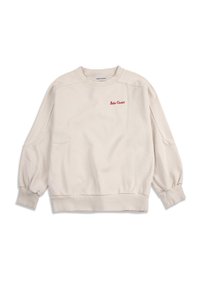 Sudadera beige de manga larga con cuello redondo, puños y dobladillo acanalados, con un pequeño texto rojo "Bobo Choses" en el pecho izquierdo.