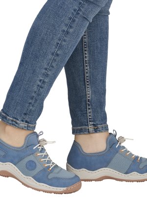 Light blue sneakers with a textured mesh and leather upper. Rounded toe, flexible sole, and contrasting orange accents on laces.