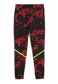 Tight black leggings with a bold red and black abstract pattern and a neon yellow diagonal stripe across the lower legs.