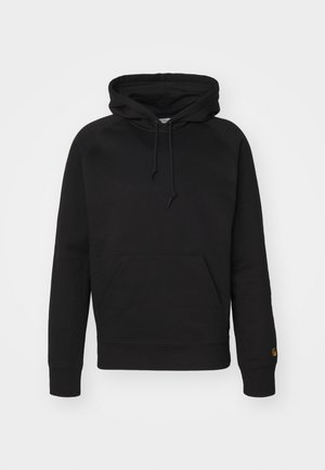 Black hoodie in soft fabric, featuring a front pouch pocket, adjustable drawstring, and ribbed cuffs. Smooth texture with minimal detailing.