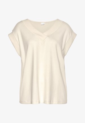 Blouse à manches courtes couleur crème avec col en V large et manches retroussées, confectionnée dans un tissu doux et léger.