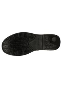 Svart gummisul med strukturerat mönster, med cirkulär detalj, platt design och en slät, hållbar yta.