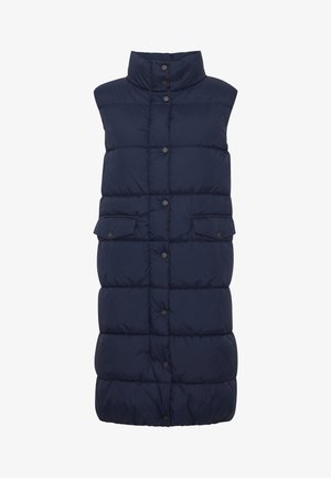 Tumed puffer vest kõrge kaelusega, näppude sulgemisega ja kahe ees oleva klapiga taskuga; sisaldab koosseisus quiltitud disaini lisatekstuuri jaoks.