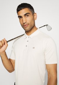 Calvin Klein Golf PLANET  - Polo marškinėliai - sand