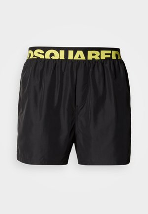 Sorte badeshorts lavet af letvægtsmateriale med en gul elastik i taljen med "DSQUARED2"-logoet og et klassisk design med syningsdetaljer.