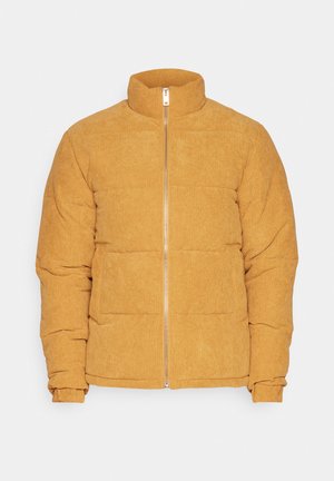 Kollane kangast pufjaket kõrge kraega, ees tõmblukuga ja õmblustega paneelidega disain. Omab ribakujulisi mansette ja tekstuurset pinda.
