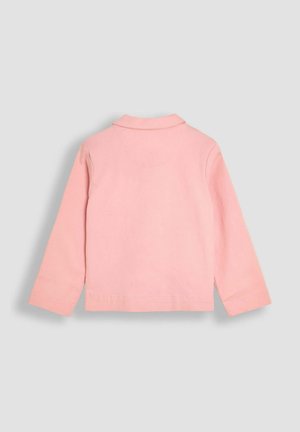 Camisa de manga larga rosa pálido con cuello clásico, espalda sin costuras y aberturas laterales, fabricada en un tejido suave y transpirable.