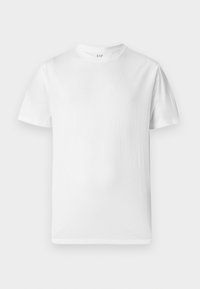 T-shirt blanc à manches courtes en coton doux. Il présente un col rond et un ourlet droit avec un minimum de détails.