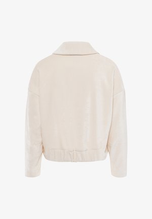 Bijgesneden lichtbeige jas met een zachte textuur, brede kraag, afgezakte schouders en elastische zoom. Heeft een minimalistisch ontwerp zonder versieringen.