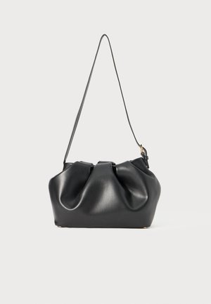 Black leather handbag with a gathered design, flat base, and a thin shoulder strap. Features subtle sheen and gold hardware accents.