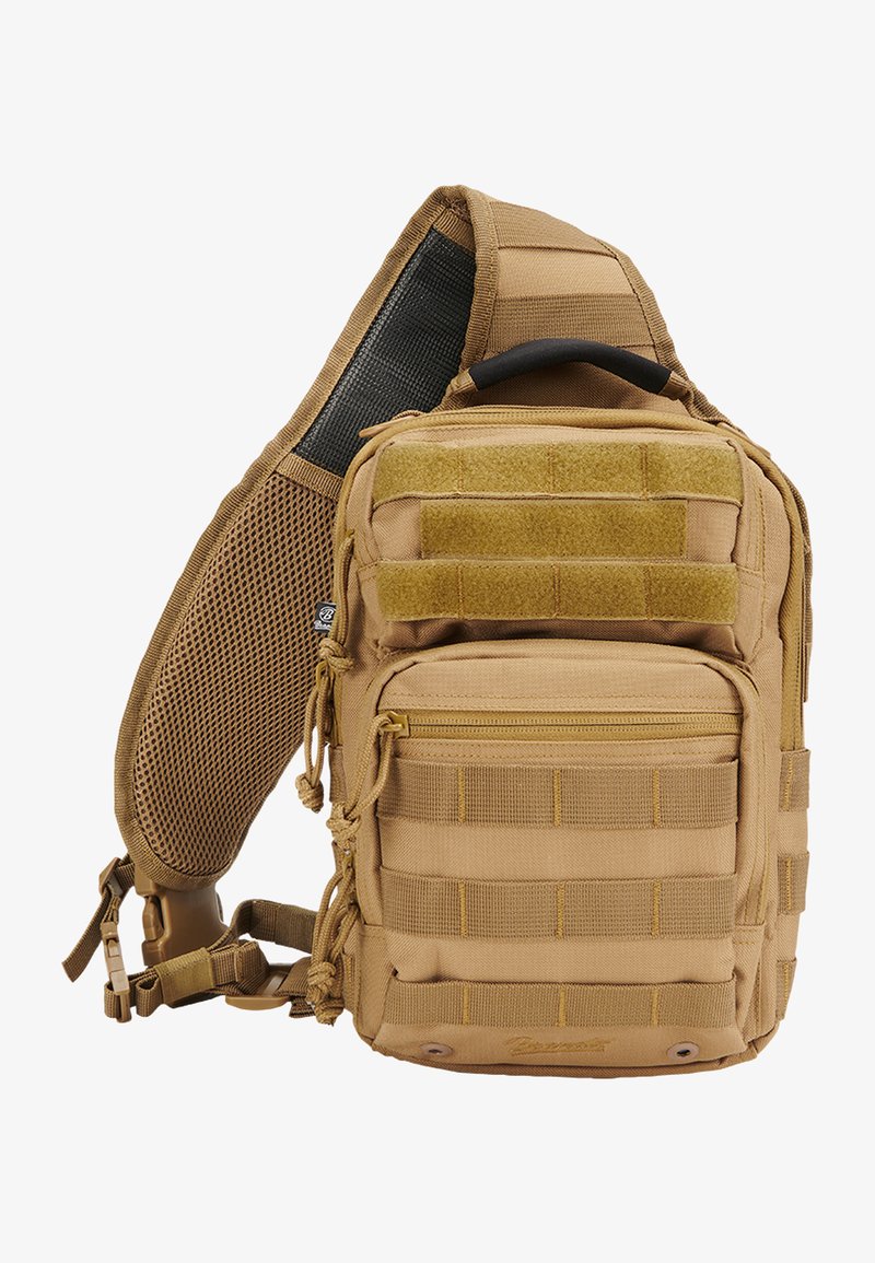 Zaino tattico beige con numerose tasche, cinghie in rete, schienale in rete imbottito, cerniere e cuciture rinforzate per una maggiore durata.