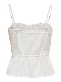 Haut blanc sans manches style peplum avec bretelles fines réglables, bordure en dentelle à l'encolure et rayures verticales texturées sur toute la surface.