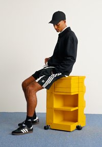 adidas Originals ADIDAS NTS RADIO ALLOVER PRINTED SUPERSTAR TRACK PANTS - Teplákové kalhoty - black