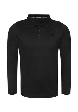 Camisa polo de manga larga negra hecha de algodón. Presenta un cuello clásico, tapeta con tres botones y un pequeño logo bordado en el pecho.