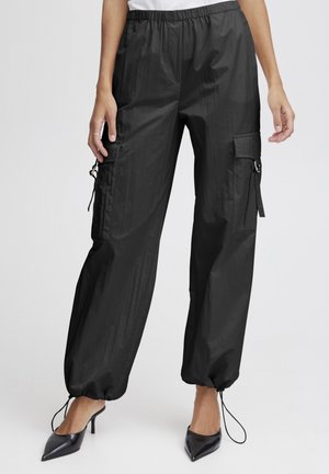 DATINE PARACHUTE - Cargo trousers - black