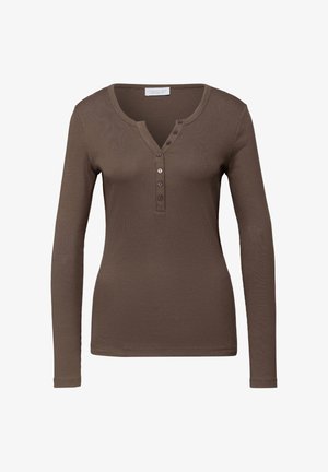 Camicia marrone a maniche lunghe con scollo a V e patta con quattro bottoni. Realizzata in tessuto di maglia testurizzato.