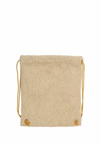 Beige tygpåse med dragsko, med en mjuk, texturerad yta och gula snören. Har rundade nedre hörn och detaljering med metallringar.