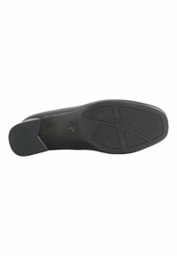 Musta kenkäpohja, jossa on teksturoitu kumipinta. Ominaisuuksina pyöristetty reuna ja geometrinen kuviio, jossa on brändi "Nine West" kohokuvioituna.