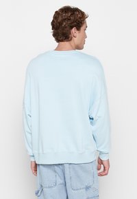 Alpha Industries Felpa - organic sky blue