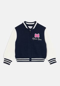Námornícky a biely pletený zipsový kabátik so pruhovanými manžetami a golierom, s ružovou mašľou a vyšívaním "Minnie Mouse" na prse.