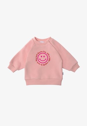 Rosa Baumwoll-Sweatshirt mit Raglanärmeln, das ein Smiley-Design und den Text "Träum groß, füge ein kleines Lächeln hinzu" in Rot zeigt.