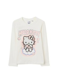 Creme kleuren blouse met lange mouwen, voorzien van een glinsterende, gestipte Hello Kitty afbeelding, roze accenten en sterontwerpen op een lichtblauwe wolkenachtergrond.