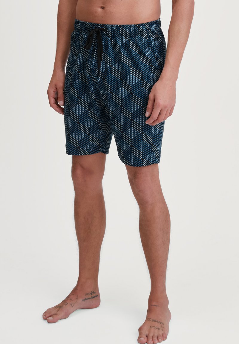Swim shorts in navy with a geometric pattern. Made from lightweight material, featuring an elastic waistband and adjustable drawstring.