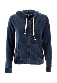 Sudadera con cremallera de pana en color azul marino, con bolsillos frontales, capucha con cordón y borlas de color claro. Tiene puños y dobladillo acanalados.