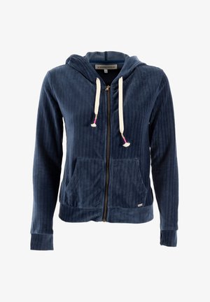 Haut à capuche zippé en velours côtelé bleu marine avec poches avant, capuche à cordon et gland de couleur claire. Présente des poignets et un ourlet côtelés.