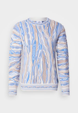 Pleteni džemper u plavoj i bež boji, s uzorkom u obliku vrtloga, rebrastim izrezom i manšetama. Teksturirani materijal s vidljivim detaljima šavova.